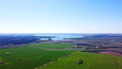 Aerial view of the summer landscape with green fields and meadows