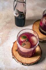 pink elderberry mocktail in a glass