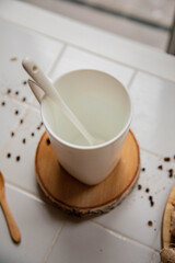 white mug with a spoon on a white background