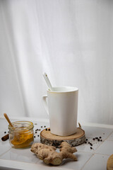white mug with a spoon on a white background