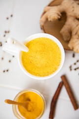 Traditionnal golden latte in a white mug