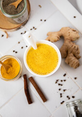 Traditionnal golden latte in a white mug