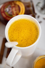 Traditionnal golden latte in a white mug