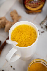 Traditionnal golden latte in a white mug