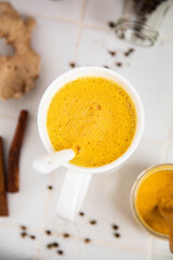 Traditionnal golden latte in a white mug