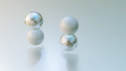 white and silver spheres one on top of the other. abstract composition. 3d render illustration