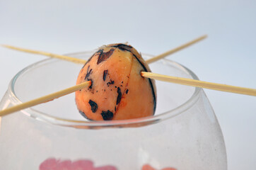   Avocado seed in a mug on a white background. Growing from seed. Isolate  