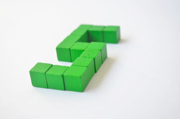 Number five from green cubes on a white background.