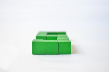 Number five from green cubes on a white background.