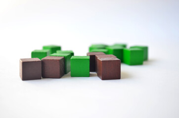 Green and brown cubes, squares on a white background.