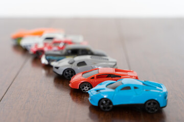 Line of toy cars of different colors. Race competition, collection concepts