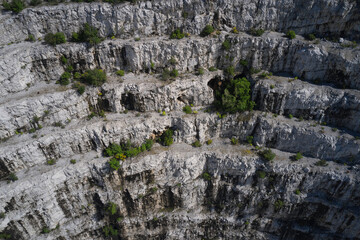 Italian marble quarries. Aerial view of an abandoned marble quarry. Top view of used mining in the alps.