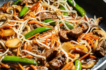 Closeup of Stir-fry in a skillet being Cooking to perfection.