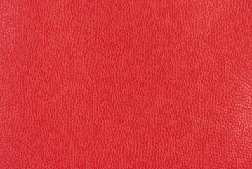 Coral red textured smooth leather surface background, small grain