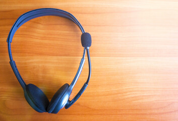 headphones, phones, earphones close up. earphones on a wooden surface