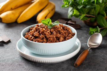 Chocolate oatmeal in white bowl for breakfast