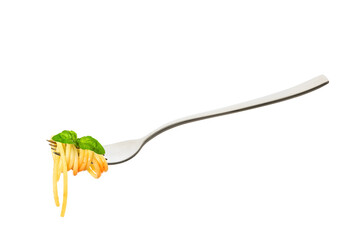 Cooked spaghetti pasta rolled on the fork with leaf of basil and tomato sauce, isolated on white