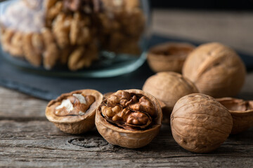 Heap of splited walnuts on rustic wooden table