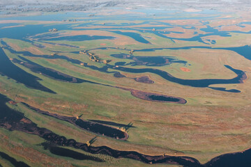 Aerial view of the Volga River in the lower reaches where the main channel splits into many small...