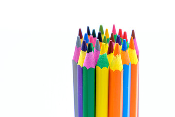 colored wooden pencils on white background