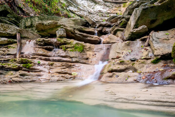 Autumn landscape. Cascades of small waterfalls of the mountain river. Jane River. Krasnodar...