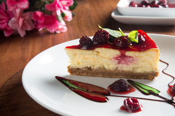Cheesecake in a white plate. Front view