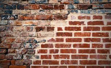 Abstract Old Distressed Brick Wall Red And Black Color. Decay Urban Texture Brick Material. Grungy Rusty Brickwork Surface. Concrete Plaster Cement Mortar.