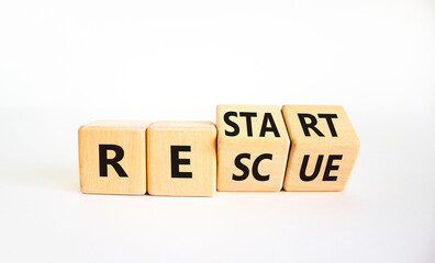 Restart and rescue symbol. Turned cubes and changed the word 'restart' to 'rescue'. Beautiful white background. Business and restart - rescue concept. Copy space.