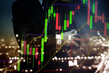 Business man action against candle stick graph chart of stock market investment trading, monotone...
