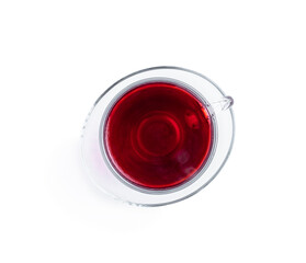 Cup of hibiscus tea isolated on white background. Top view