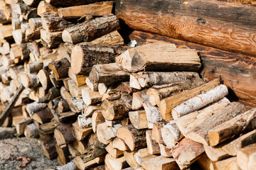 Woodpile of a birch firewood. Close-up, background. Texture.