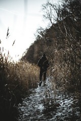 a man walking along the path