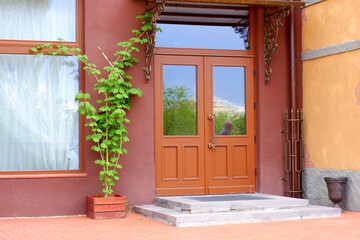Wooden door with windows on the porch