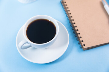Obraz na płótnie Canvas notepad with cup of coffee