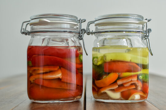 Homemade food: different kind of peppers ready to ferment in a mason jar
