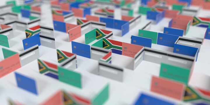 Flag of South Africa on the mockup credit card maze. Financial problems related 3D rendering