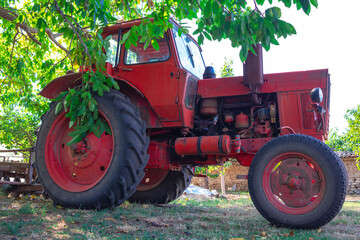 Tractor in a farmland. Horticulture concept