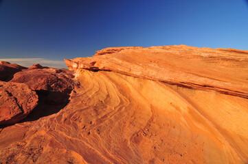 Fototapeta na wymiar Eons of pock marked and striated rocks in the Arizona desert