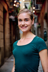 young blonde woman looking direct to camera and smiling