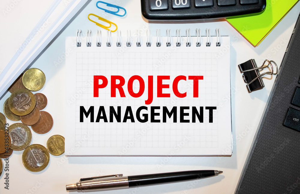 Poster project management memo written on a notebook with pen
