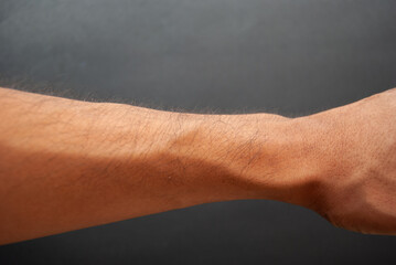 Fototapeta na wymiar Arm and hand of a man