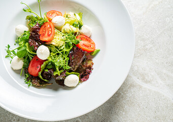 fresh salad with mozzarella and vegetables