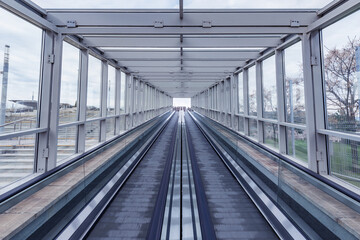 Empty moving escalator tracks.
