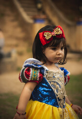 selective focus on girl disguised as Snow White