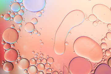 Colorful artistic of oil drop floating on the water. Abstract pastel bubble background.