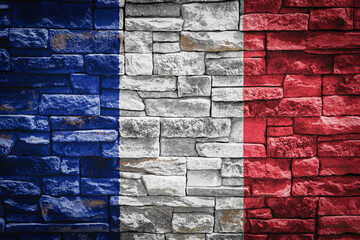National flag of France on stone  wall background.The concept of national pride and symbol of the...