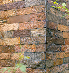 Shiny colorful stone brick wall corner seamless pattern and texture.