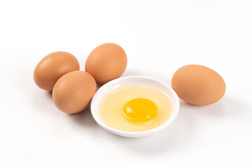 Raw brown chicken eggs on white background