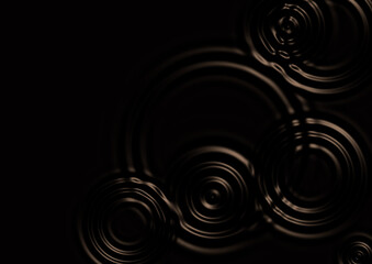 黒い水面に広がる波紋