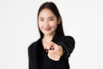 Young and cute beautiful black long hair woman pose with self-confidence on white background. She pointing finger camera